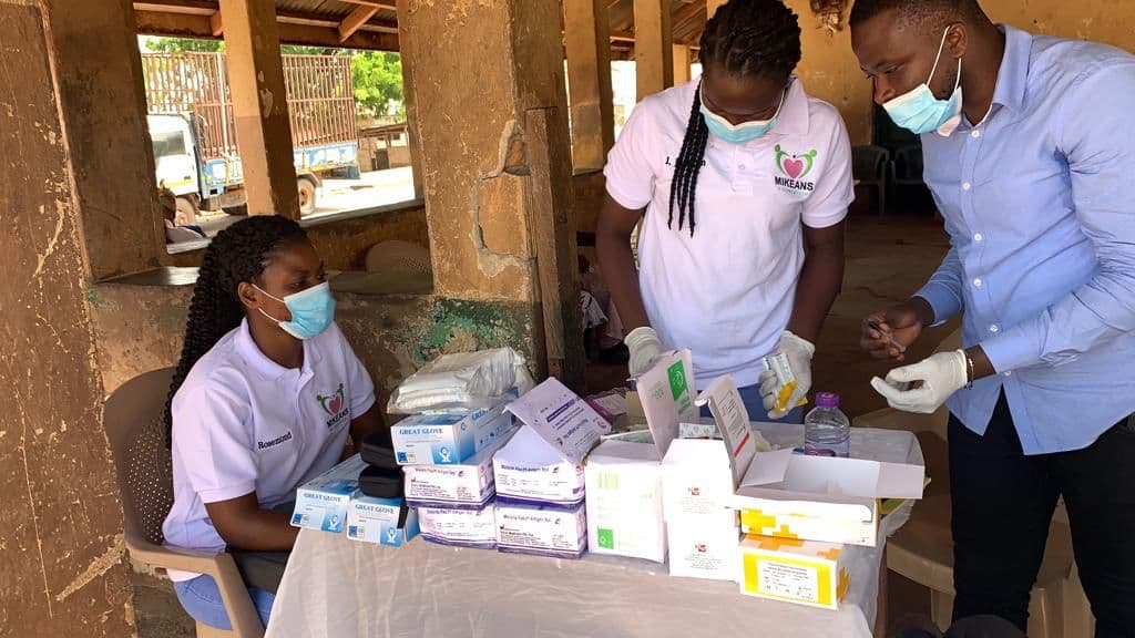 Healthcare professionals supporting a community screening in Bekwai
